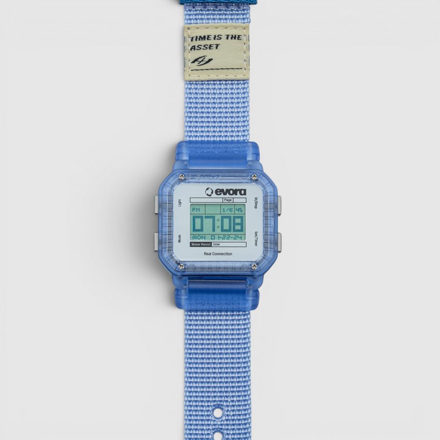 EVORA Jelly (v2) digital watch with translucent blue case on a light blue nylon band