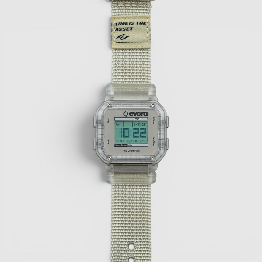 EVORA Ice (v2) digital watch with translucent frosted-clear case on a light grey nylon band