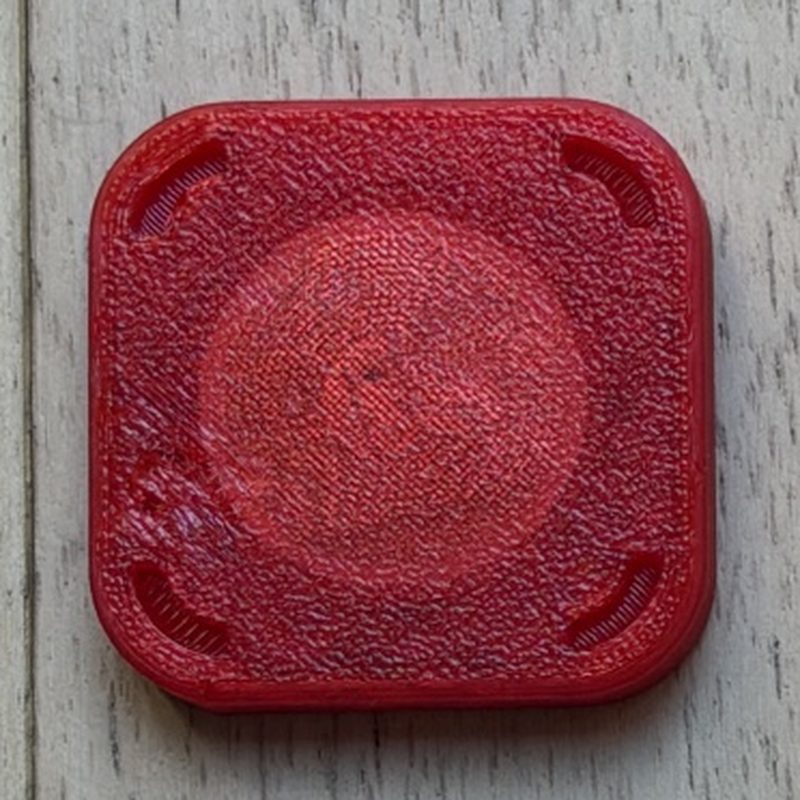 Handmade translucent red 3D-printed NFC tag